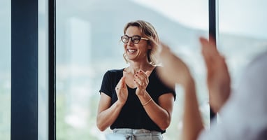 Woman giving a round of applause