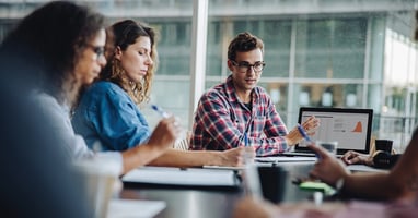 3 people focusing and working together on a task