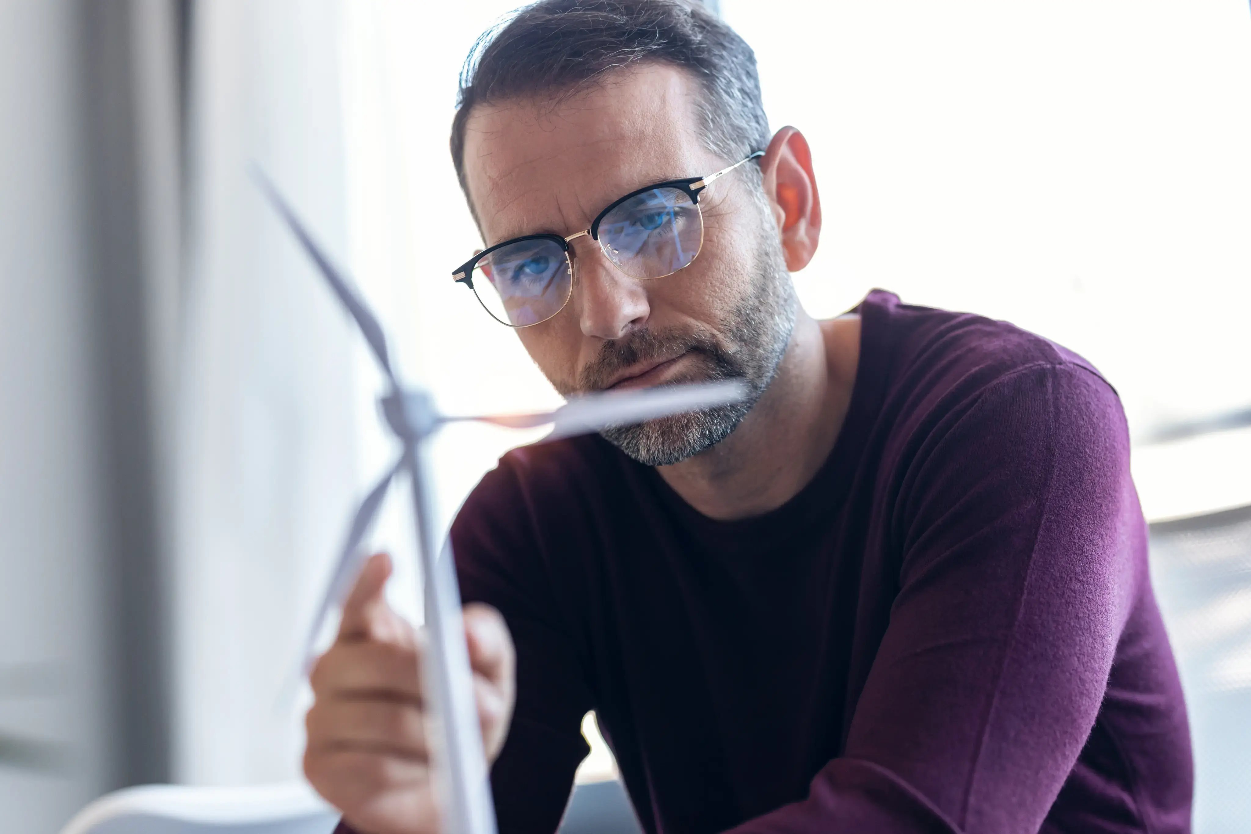 man-with-a-model-of-wind-turbine