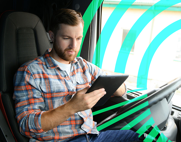 man with ipad in van